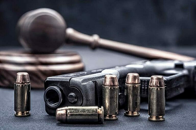 Judge's gavel with handgun and ammunition